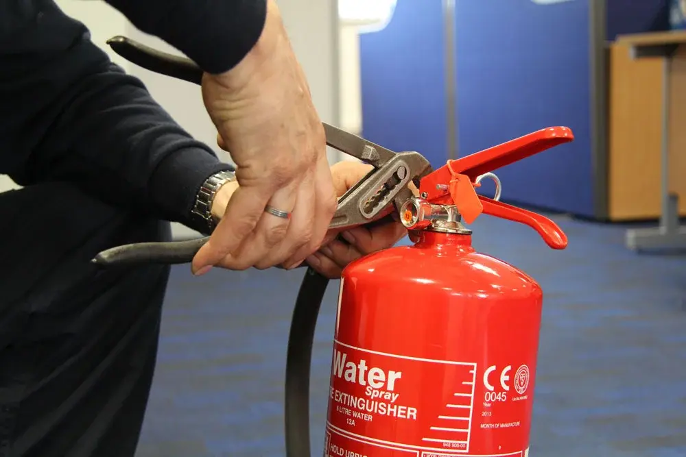 Fire extinguishers being refilled
