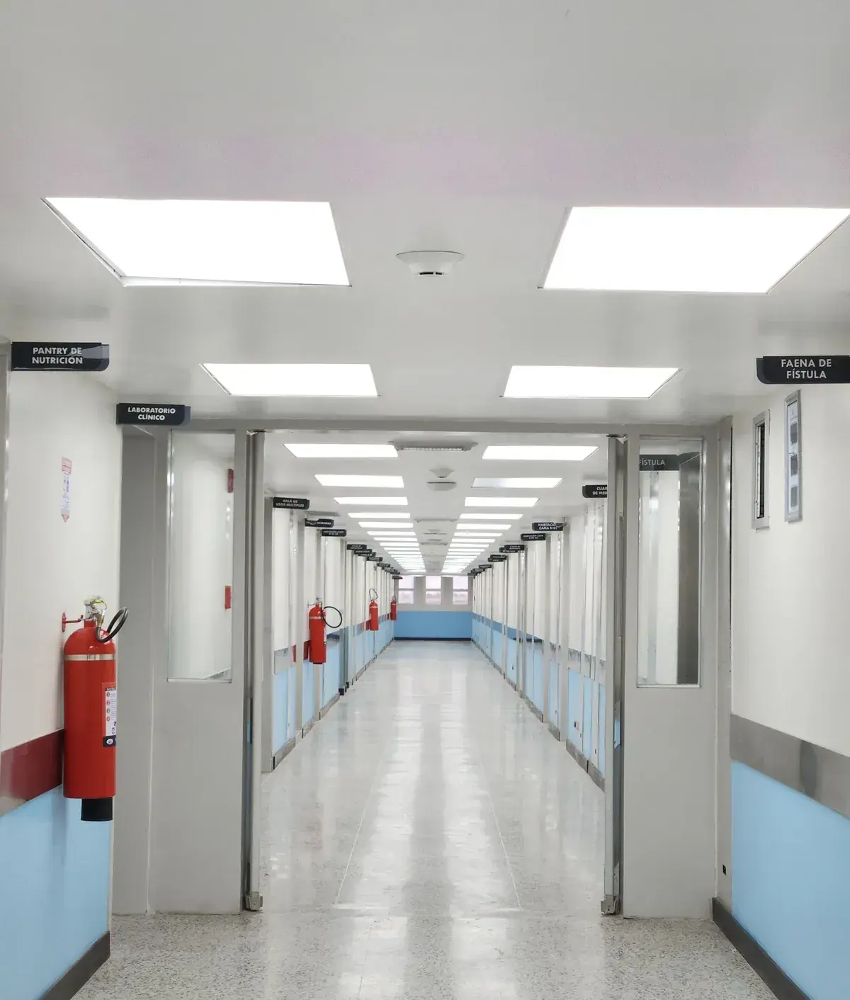 Hospital corridor with wall-mounted fire extinguishers
